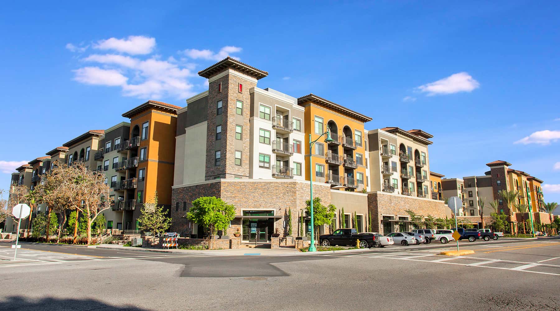 Exterior of a Colony at the Lakes apartment building on a street corner.