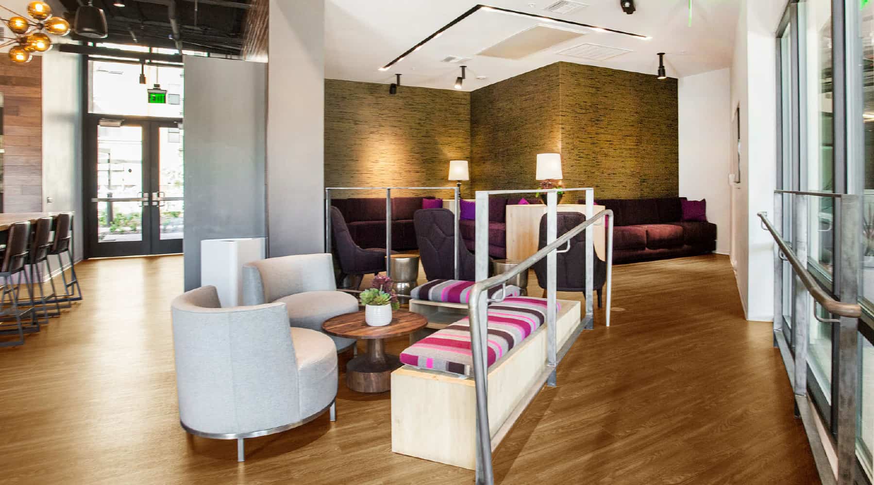 Modern apartment lounge with cozy seating and contemporary decor.