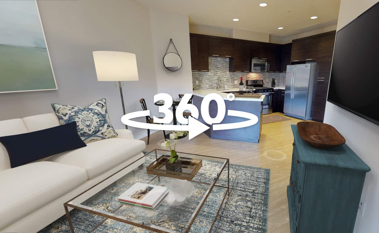 360-degree view of a one-bedroom, one-bathroom apartment featuring a cozy living room and a modern kitchen.